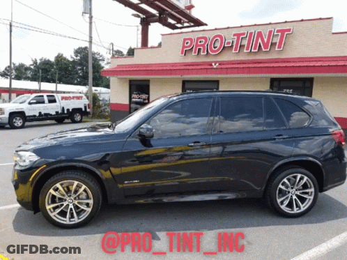 Black SUV Parked At Pro Tint Building GIF