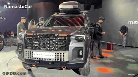 Black SUV Parked In Front Of Brick Wall GIF
