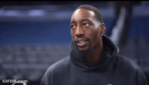Black Sweatshirt Man Talking Into Mic Holding Phone GIF