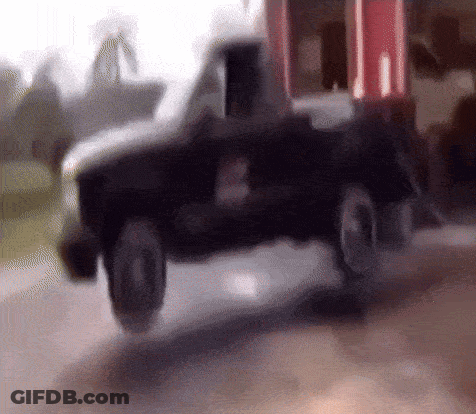 Black Toy Truck Driving Down Road GIF