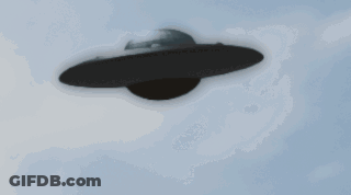 Black UFO Flying Through Blue Sky GIF