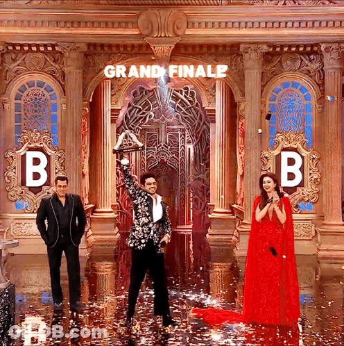 Black White Suit Man Holds Trophy Grand Finale GIF