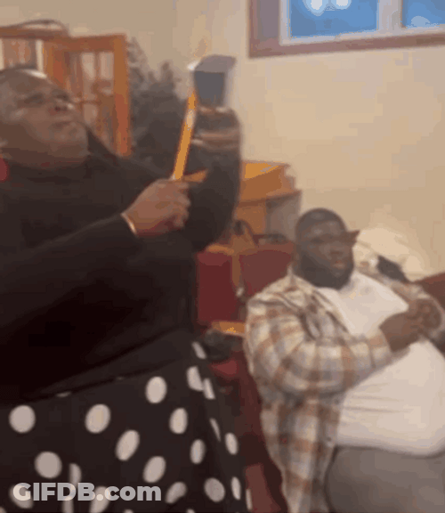 Black Woman Ringing Cowbell GIF