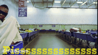 Blindfolded Man In Shopping Cart With $0.99 Sign GIF
