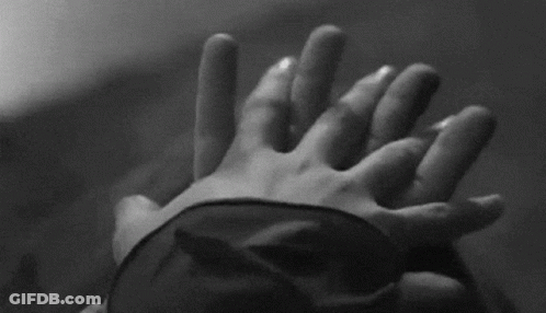 Blindfolded Person Holding Another's Hand GIF