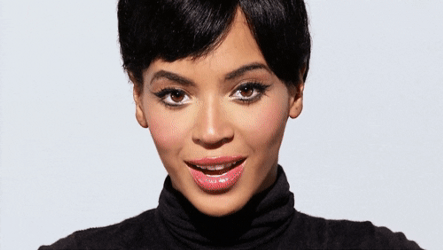 Blinking Beyonce Smile GIF