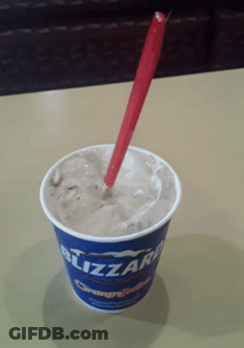 Blizzard Ice Cream Cup With Red Spoon GIF