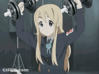 Blonde Anime Girl Lifting Dumbbells In Front Of Keyboard GIF