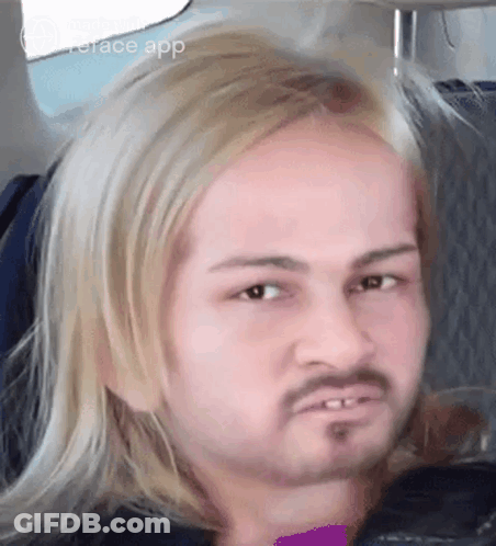 Blonde Bearded Man Making Funny Face On Airplane GIF