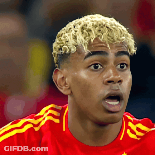 Blonde Curly Hair Man In Red And Yellow Adidas Jersey GIF