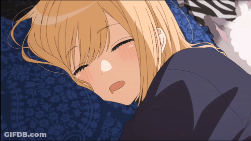 Blonde Girl Laying On Blue Pillow With Eyes Closed GIF