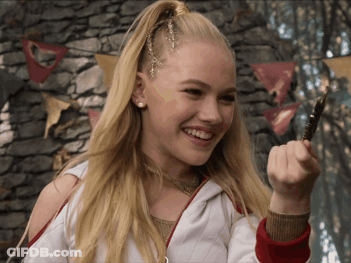 Blonde Girl Smiling Holding Pen GIF