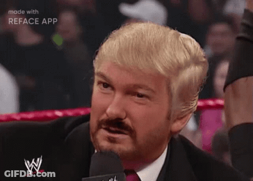 Blonde Haired Bearded Man In Suit Speaking Into Microphone GIF