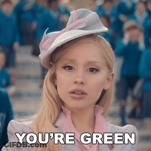 Blonde In Pink Dress And White Hat Saying You're Green GIF