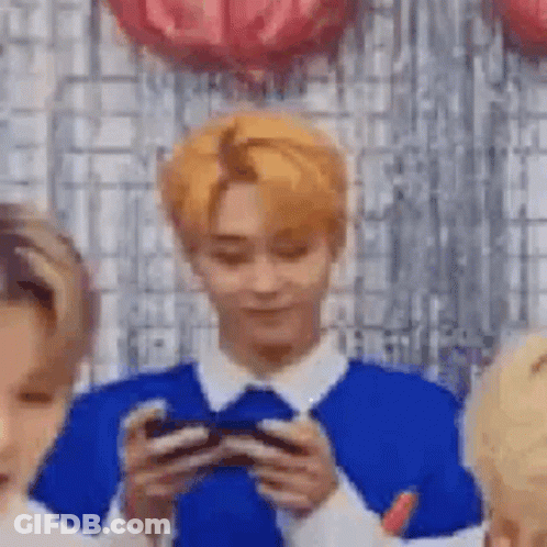 Blonde Man Holding Cell Phone GIF