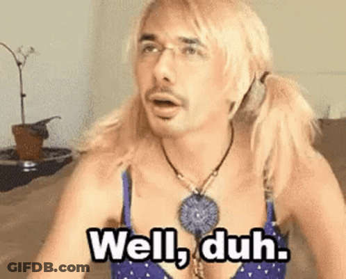 Blonde Man In Bra Necklace Saying Well Duh GIF