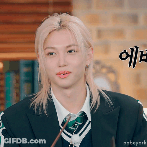 Blonde Man In Suit Holding Wand GIF
