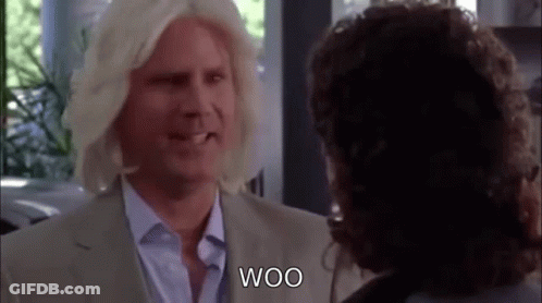 Blonde Man In Wig Talking To Another Man GIF