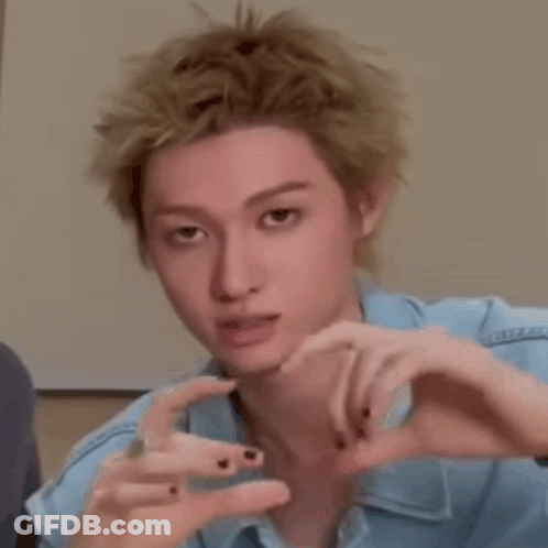 Blonde Man Making Heart Shape With Hands GIF