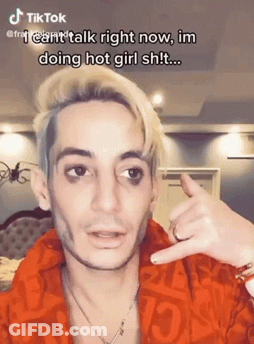 Blonde Man Red Jacket Making Call Me Sign GIF