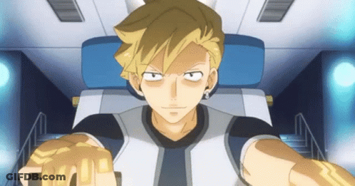 Blonde Man Sitting In Chair With Fist In The Air GIF
