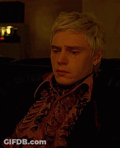 Blonde Man Sitting On Couch Crying GIF