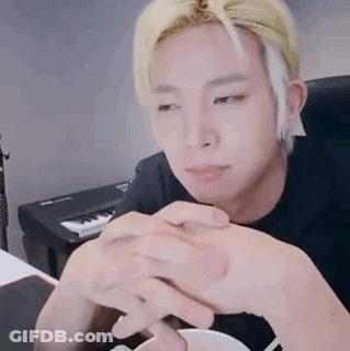 Blonde Man Sitting With Folded Hands GIF