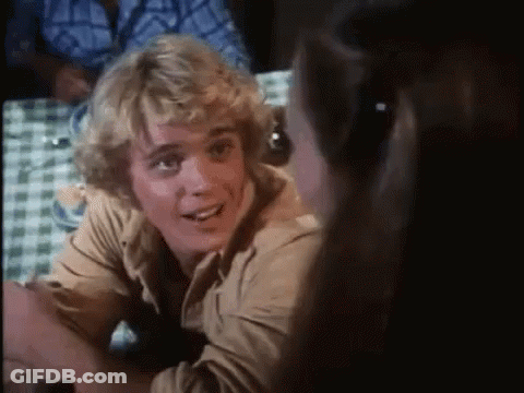 Blonde Man Smiling At Table With Woman GIF