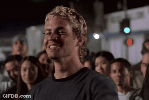 Blonde Man Smiling In Crowd GIF