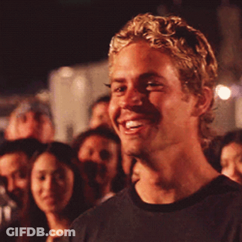 Blonde Man Smiling In Crowd GIF
