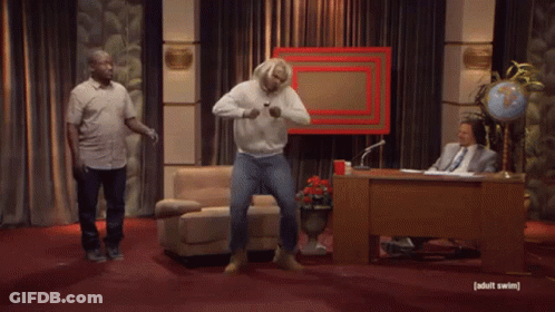 Blonde Man Standing In Front Of Globe GIF