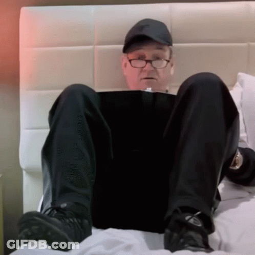 Blonde Man Standing Next To Man In Blue Shirt GIF