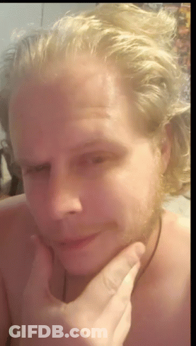 Blonde Man With Beard Holding Hand To Face GIF