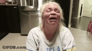 Blonde Woman Crying In Kitchen UCLA Shirt GIF