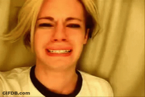 Blonde Woman Crying In White Shirt And Black Collar GIF