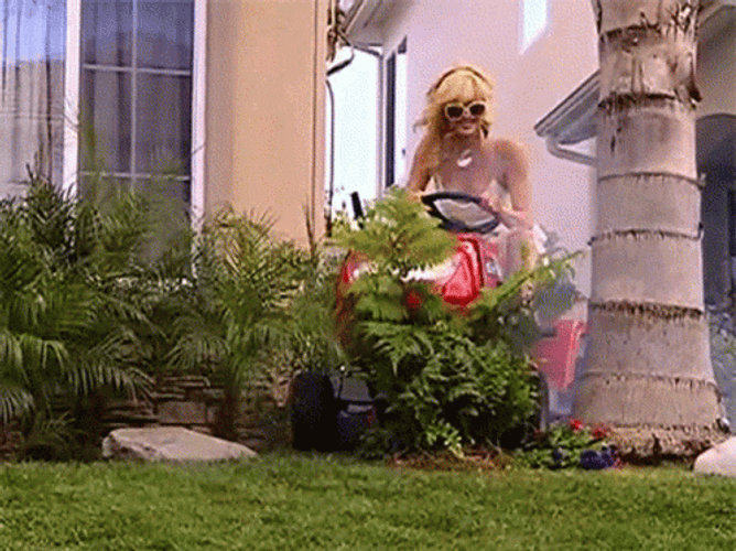 Blonde Woman Gardening Happily GIF
