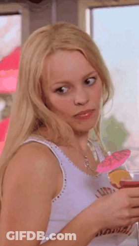 Blonde Woman Holding Drink With Pink Umbrella GIF
