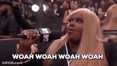 Blonde Woman Holding Microphone GIF