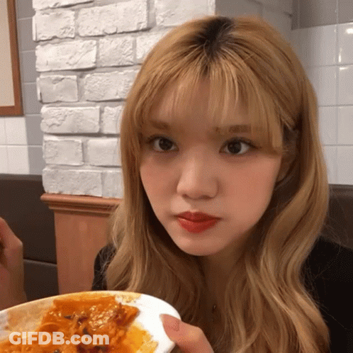 Blonde Woman Holding Plate Of Food GIF