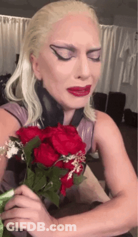 Blonde Woman Holding Red Roses GIF