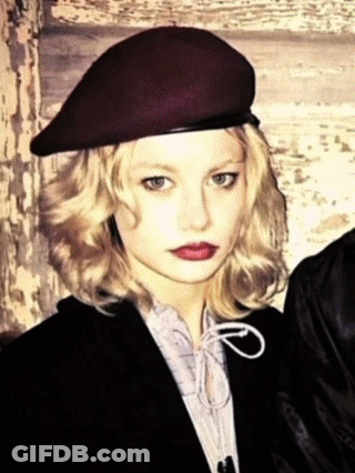 Blonde Woman In Beret And Jacket GIF