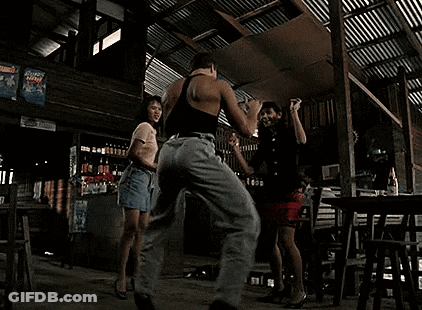 Blonde Woman In Black Bra And Necklace Looking Away GIF