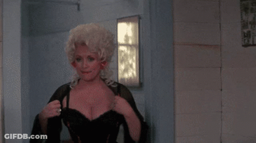 Blonde Woman In Black Dress With Red Nails GIF