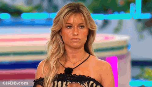 Blonde Woman In Black Lace Top And Necklace GIF