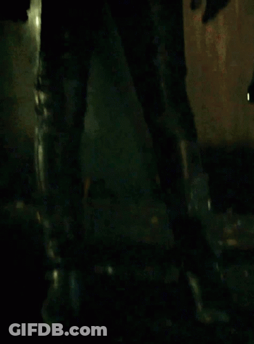Blonde Woman In Black Mask And Leather Jacket GIF