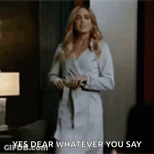 Blonde Woman In Black Mask And Suit GIF