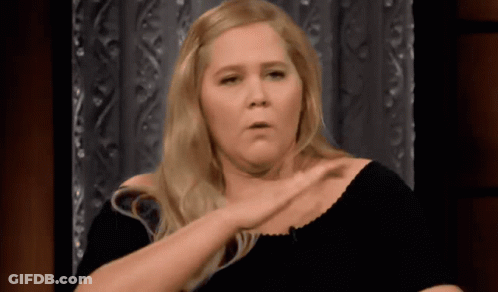 Blonde Woman In Black Shirt Making Funny Face GIF