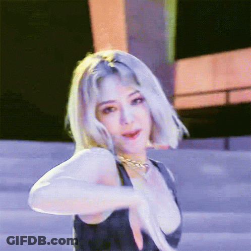 Blonde Woman In Black Tank Top And Gold Necklace GIF