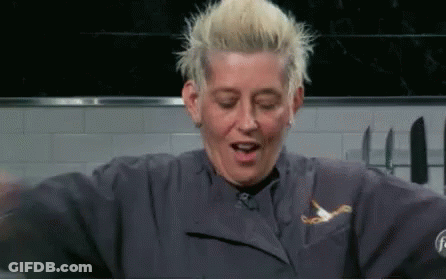 Blonde Woman In Blue Chef Jacket Making Funny Face GIF