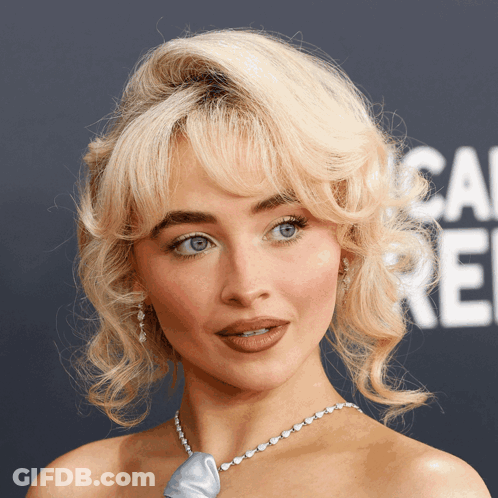 Blonde Woman In Blue Necklace GIF